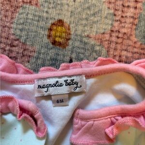 Magnolia baby. Baby girl one piece. Light green with pink detail.
